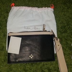 India Hicks black and tan wristlet